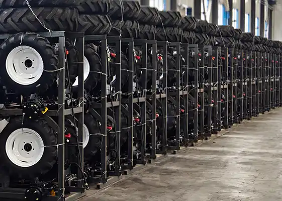 Lineup of XT series tractors secured in steel iron frames for SKD export, demonstrating safe and space-saving logistics for wholesale dealer orders.